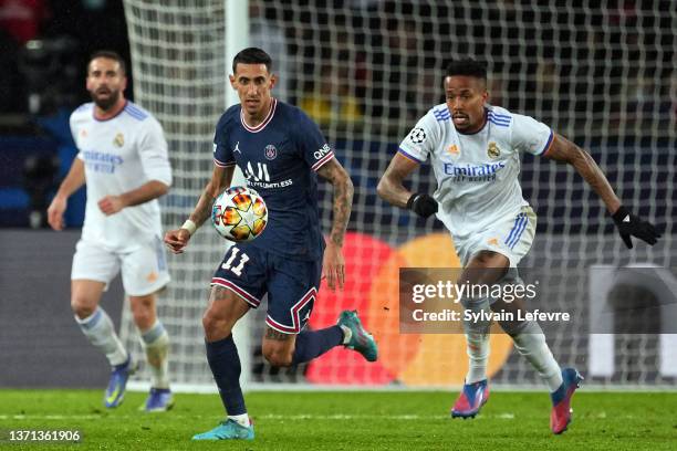 Angel Di Maria of Paris SG competes for the ball with Eder Militao of Real Madrid during the UEFA Champions League Round Of Sixteen Leg One match...