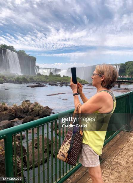 take a photo of iguassu falls - foz do iguacu stock pictures, royalty-free photos & images