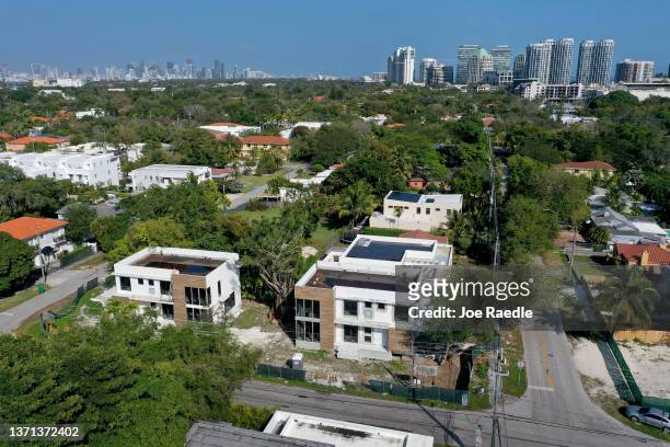In an aerial view, homes that Zillow estimates will be worth approximately 1 000 dollars are under construction in the Coconut Grove neighborhood on...