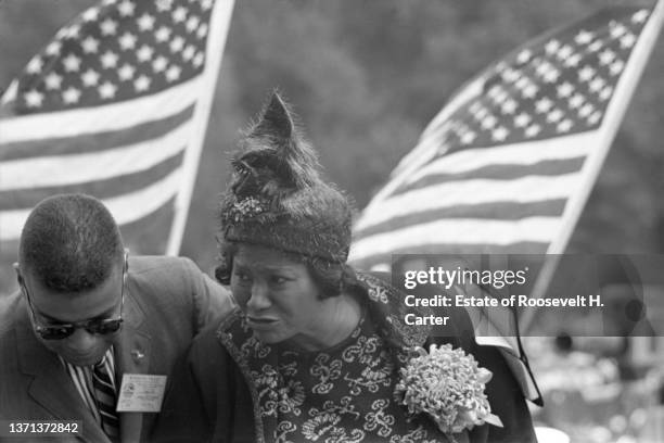 American gospel singer Mahalia Jackson , along with an unidentified journalist, attends the March on Washington for Jobs and Freedom, Washington DC,...