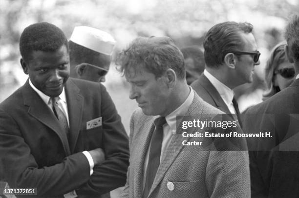 American actor Sidney Poitier smiles at fellow actor Burt Lancaster during the March on Washington for Jobs and Freedom, Washington DC, August 28,...