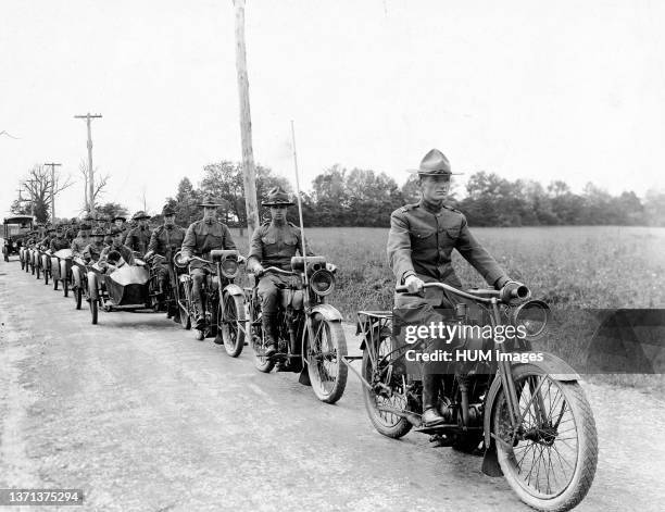 Harley Davidson motorcycles, some with side cars on the road manufactured by the Harley Davidson Co., Milwaukee, Wis. For the War Department ca. 1918