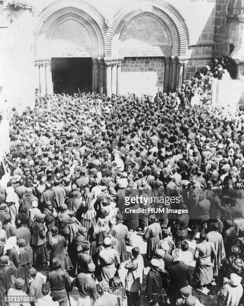 Crowd waiting for the holy fire to come down from Heaven, a miracle celebrated by the Greek Orthodox Church during Easter week, Jerusalem 1880-1900.
