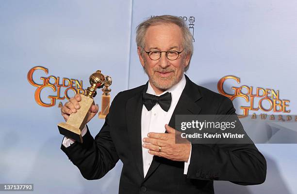 Director/producer Steven Spielberg poses in the press room with the Best Animated Film award for "The Adventures of Tintin" at the 69th Annual Golden...