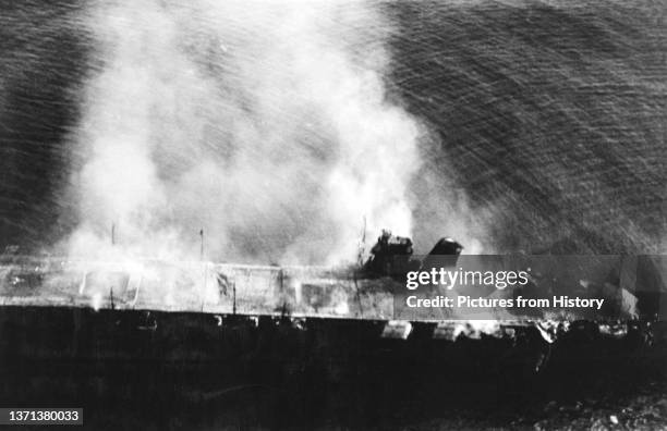 Imperial Japanese Navy aircraft carrier Hiryu abandoned and burning after the Battle of Midway, 5 June 1942.