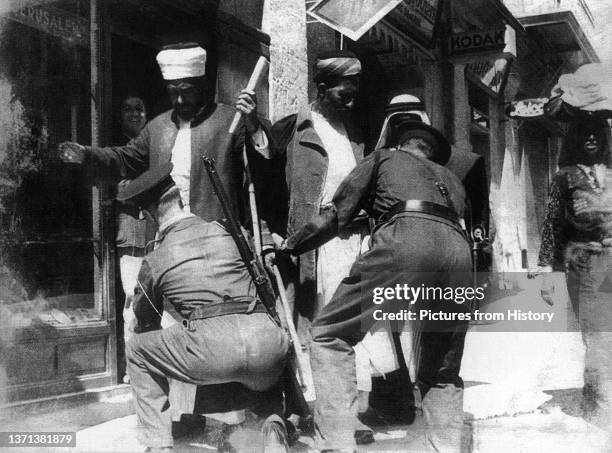 Palestinian Muslim elders searched in a Jerusalem street by Israeli forces, 1948.