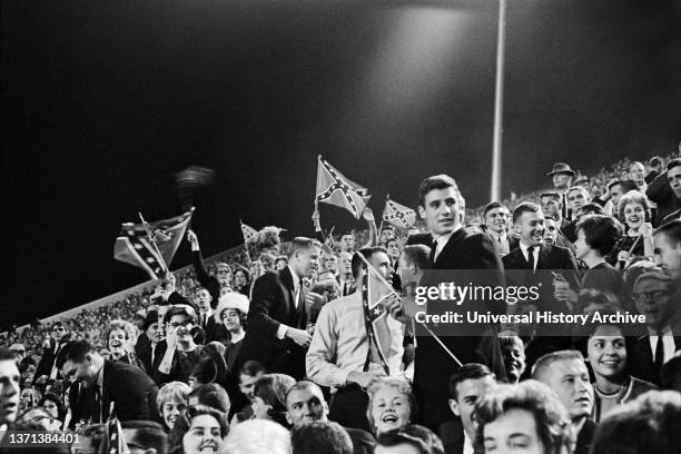 Crowd with Confederate Flags at University of Mississippi Football Game protesting James Meredith, first African-American Student to enroll at the...