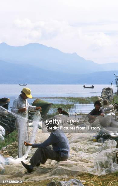 Erhai Lake is the second largest lake in Yunnan Province. Its main village, Caicun, is a maze of unpaved alleys and mud houses. On the eastern shore...