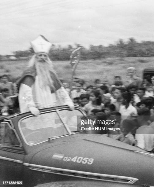 Saint Nicholas in open car during parade in Batavia , Indonesia, Jakarta, Dutch East Indies ca. 1947.
