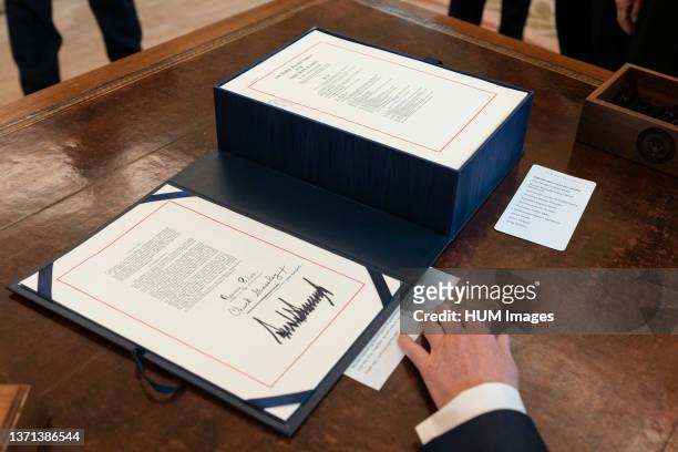 President Donald Trump's signature is seen on H.R. 748 the CARES Act the $2.2 trillion assistance package to help American workers small businesses...