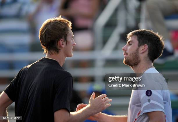 Cameron Norrie of Great Britain shakes hands with Sebastian Korda of the United States after winning their Quarterfinals match at the Delray Beach...