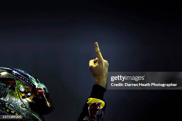 German Red Bull Racing Formula One racing team racing driver Sebastian Vettel giving his famous number one finger sign in celebration of winning the...