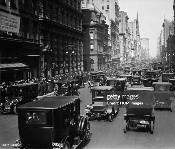 Cars driving down Fifth Avenue in New York City on Easter Sunday 1913.