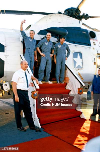 Apollo 10 astronauts Thomas P. Stafford , John W. Young and Eugene A. Cernan are greeted by Donald E. Stullken of the Manned Space Center's recovery...