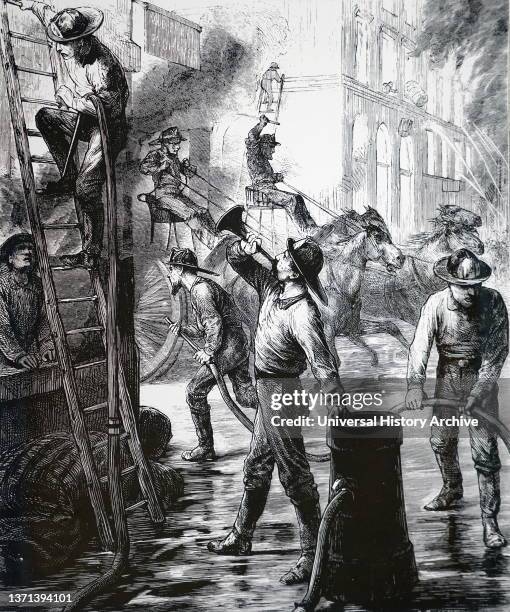 Members of the London Fire Brigade fighting a fire in a coach builders' workshops in Oxford Street near Hannover Square.