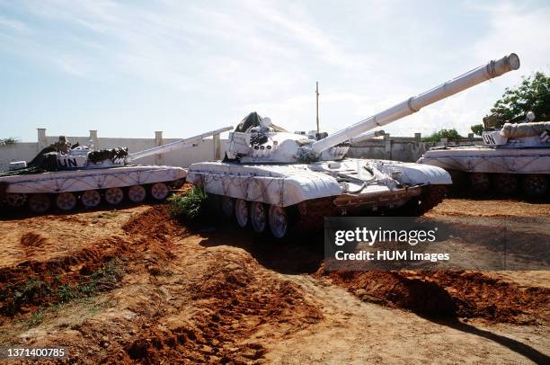 United Nations tanks at the Belgian compound in Kismayo. 3/4 right side view of a T-72 main battle tank with UN markings. The UN forces are in...