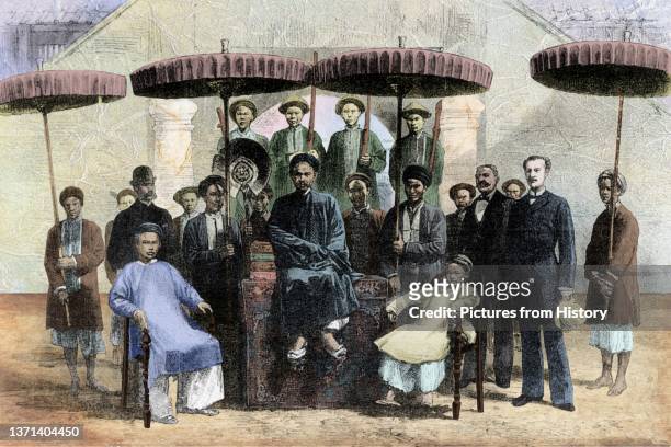 The Mandarin of the port of Haiphong with the director of police, 1883. . French Indochina was part of the French colonial empire in southeast Asia....