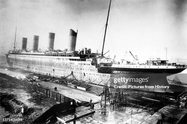 Titanic being fitted out at Harland and Wolf Shipyard, Belfast, 1911-1912.