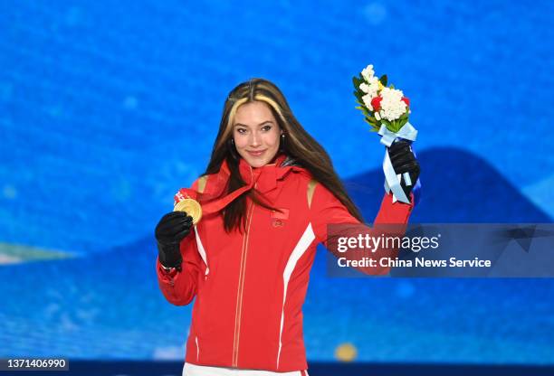 Gold medallist Ailing Eileen Gu of Team China poses with her medal during the Women's Freeski Halfpipe medal ceremony on Day 14 of the Beijing 2022...