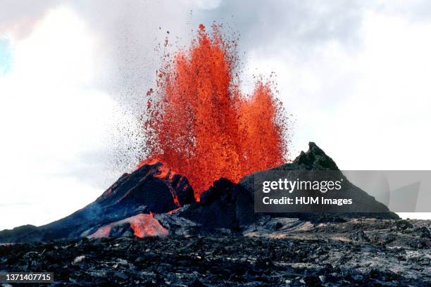 Low fountain, approximately 50 meters high, from Pu'u 'O'o on Hawai'i Island's Kilauea Volcano . Lava issuing from the breach in the northeast rim of...