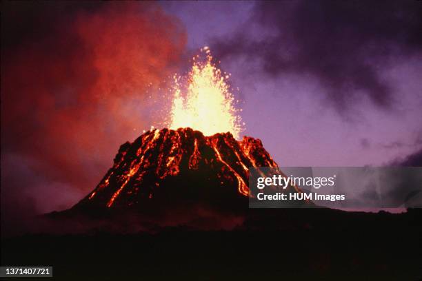View at dusk of the young Pu'u 'O'o cinder-and-spatter cone, with fountain 40 meters high, on Hawai'i Island's Kilauea Volcano June 29, 1983.