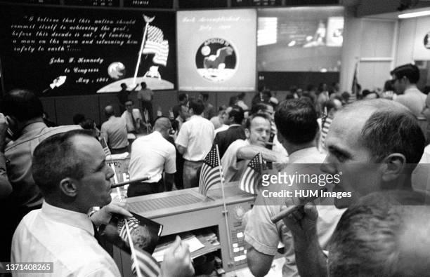 View of Mission Operations Control Room in the Mission Control Center , Manned Spacecraft Center , showing flight controllers celebrating successful...