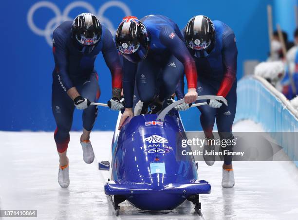 Brad Hall, Taylor Lawrence, Nick Gleeson and Greg Cackett of Team Great Britain slide during the four-man Bobsleigh heats on day 15 of Beijing 2022...