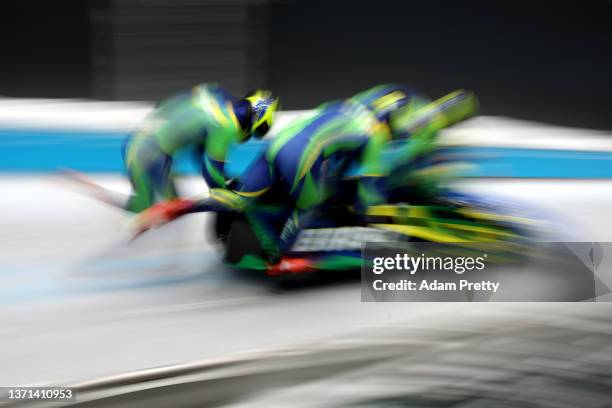 Edson Luques Bindilatti, Rafael Souza da Silva, Erick Gilson Vianna Jeronimo and Edson Ricardo Martins of Team Brazil slide during the four-man...