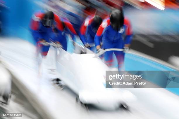 Maxim Andrianov, Aleksey Zaytsev, Vladislav Zharovtsev and Dmitrii Lopin of Team ROC slide during the four-man Bobsleigh heats on day 15 of Beijing...