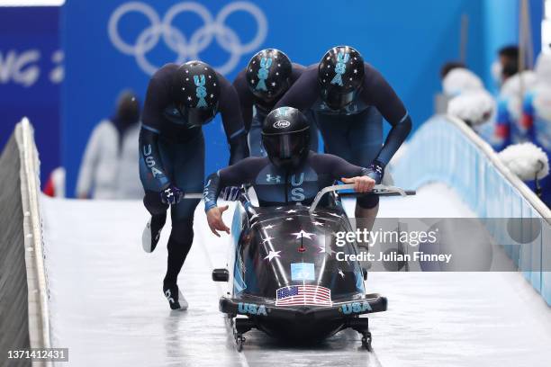 Frank Delduca, Carlo Valdes, James Reed and Hakeem Abdul-Saboor of Team United States slide during the four-man Bobsleigh heats on day 15 of Beijing...