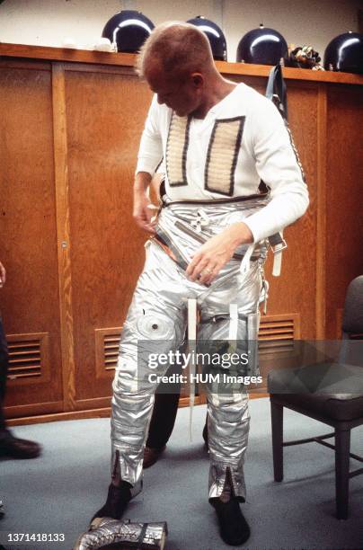 Astronaut John H. Glenn Jr. Dons spacesuit during preflight operations at Cape Canaveral, Feb. 20 the day he flew his Mercury-Atlas 6 spacecraft,...