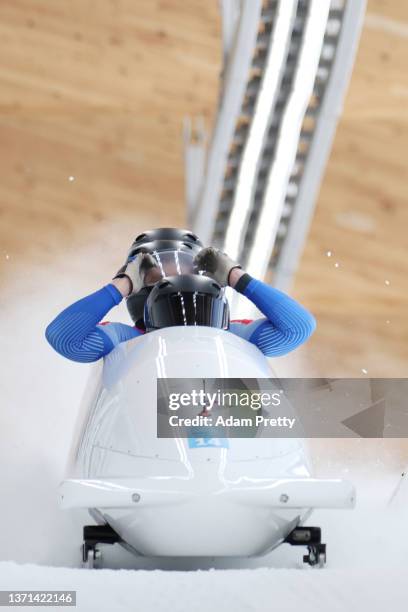 Maxim Andrianov, Aleksey Zaytsev, Vladislav Zharovtsev and Dmitrii Lopin of Team ROC react to their slide during the four-man Bobsleigh heats on day...