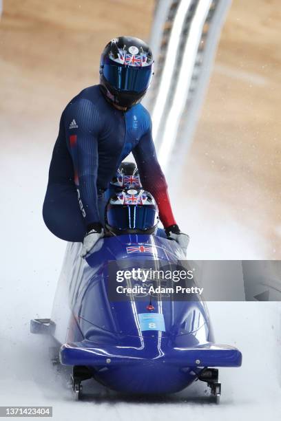 Brad Hall, Taylor Lawrence, Nick Gleeson and Greg Cackett of Team Great Britain finish their slide during the four-man Bobsleigh heats on day 15 of...