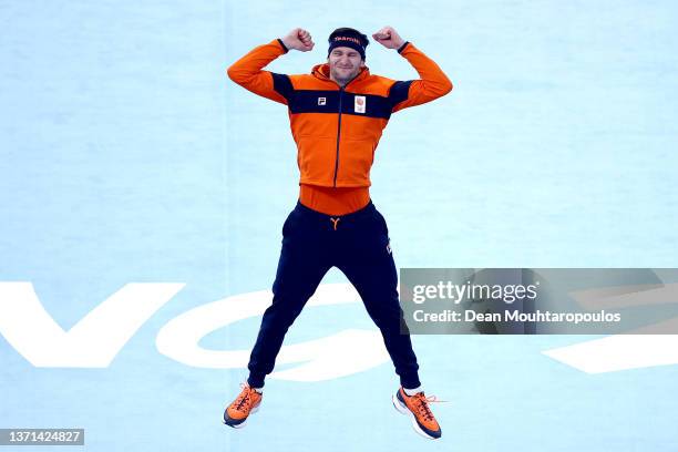 Gold medallist Thomas Krol of Team Netherlands jumps as he celebrates during the Men's 1000m flower ceremony on day fourteen of the Beijing 2022...