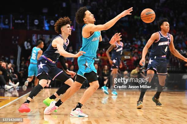 Cade Cunningham of the Detroit Pistons passes the ball as LaMelo Ball of the Charlotte Hornets defends during the 2022 Clorox Rising Stars at Rocket...