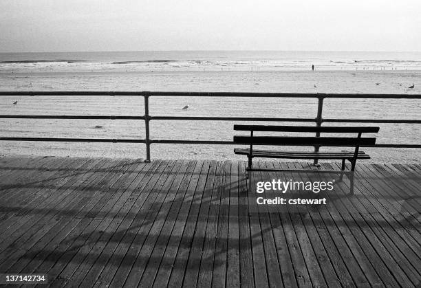 bench on the boardwalk at beach, atlantic city - atlantic city stock pictures, royalty-free photos & images