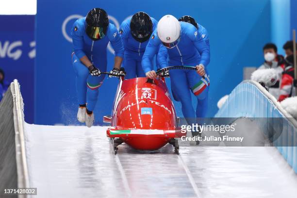 Mattia Variola, Robert Mircea, Alex Pagnini and Jose Delmas Obou of Team Italy slide during the four-man Bobsleigh heats on day 15 of Beijing 2022...