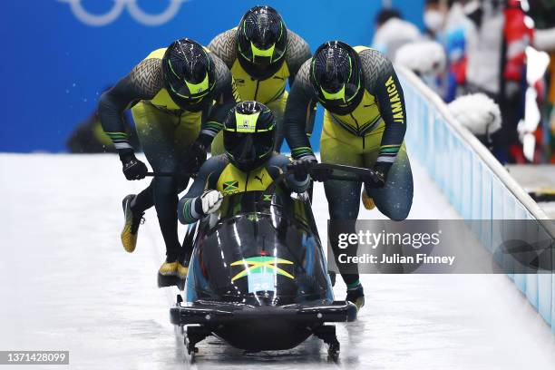 Shanwayne Stephens, Ashley Watson, Rolando Reid and Matthew Wekpe of Team Jamaica slide during the four-man Bobsleigh heats on day 15 of Beijing 2022...