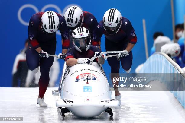 Youngjin Suk, Hyeonggeun Kim, Taeyang Kim and Ye Chan Shin of Team South Korea slide during the four-man Bobsleigh heats on day 15 of Beijing 2022...