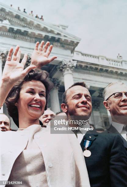 Astronaut Alan B. Shepard Jr. , along with wife Louise, waves to a crowd outside the U.S. Capitol building.
