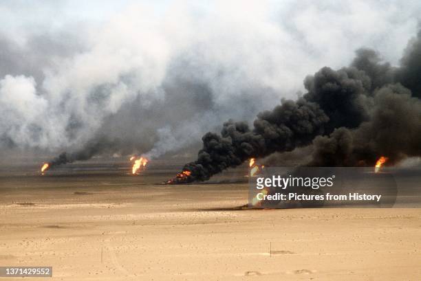 Oil well fires rage outside Kuwait City in the aftermath of Operation Desert Storm. The wells were set on fire by Iraqi forces before they were...