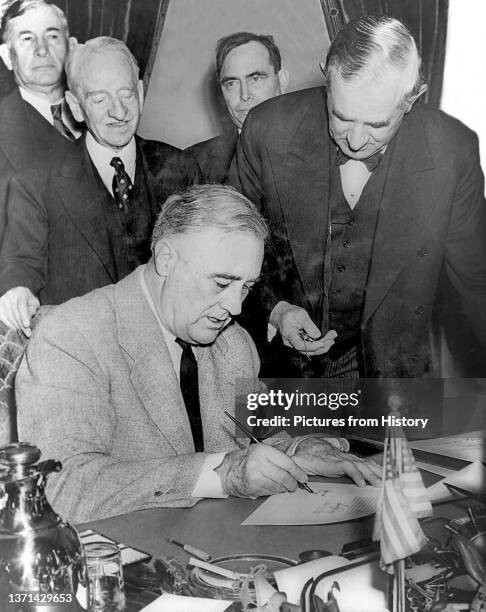 President Franklin D. Roosevelt signing the declaration of war against Germany, December 11, 1941.