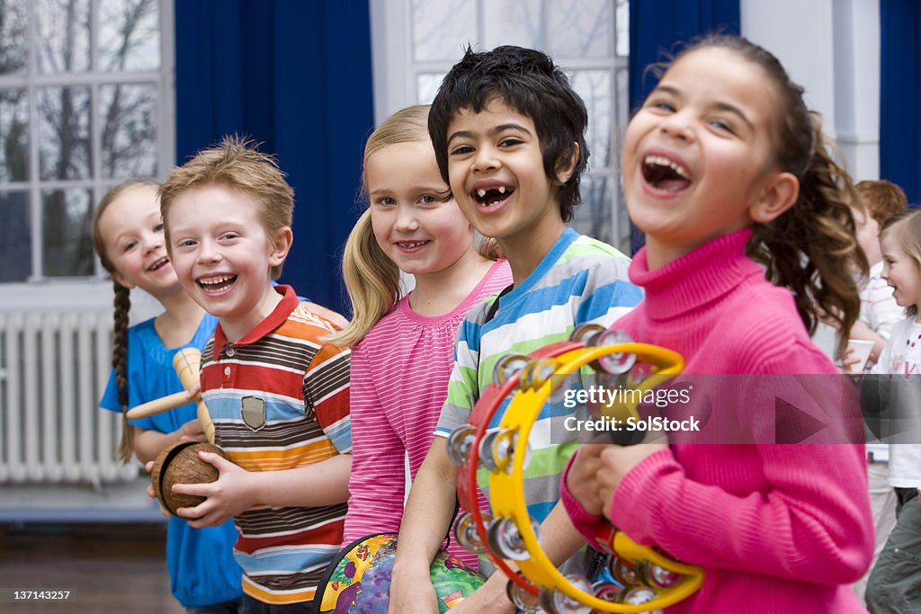 Children Having Fun in Music Class With Their Instruments