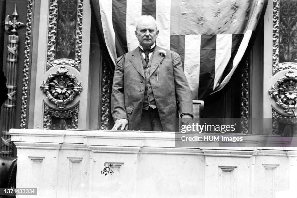 Photo shows Speaker of the House James Beauchamp 'Champ' Clark standing at the rostrum in the House of Representatives chamber, United States Capitol...