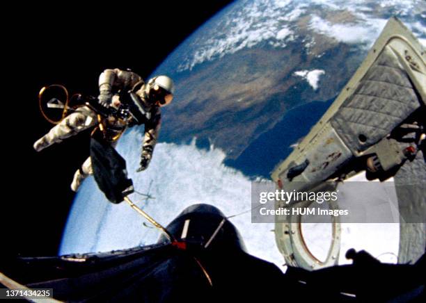 June 1965) Astronaut Edward H. White II, pilot for the Gemini-Titan 4 spaceflight, floats in the zero-gravity of space during the third revolution of...
