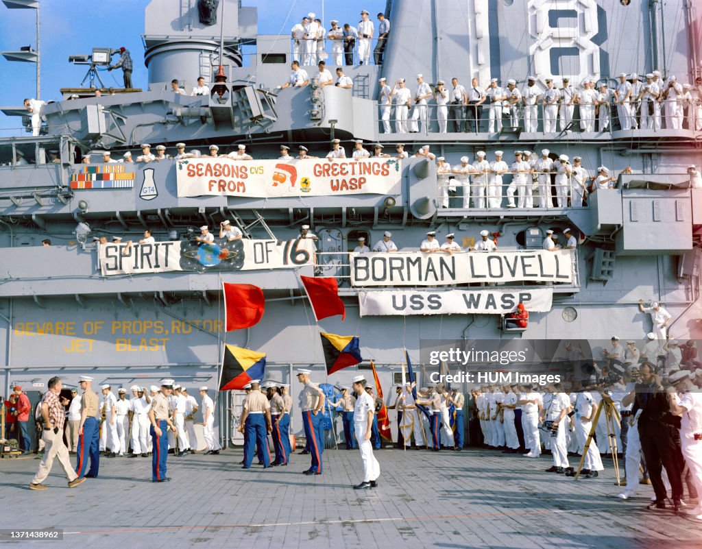 (18 Dec. 1965) --- Crewmen of the aircraft carrier USS Wasp gather on deck to watch the recovery of the National Aeronautics and Space Administration's Gemini-7 spacecraft and astronauts. Gemini-7