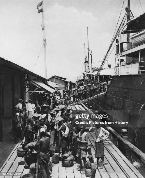 Arrivals of South Chinese contract workers in the port of Belawan on the east coast of Sumatra. Photograph by Carl Josef Kleingrothe , c. 1903.