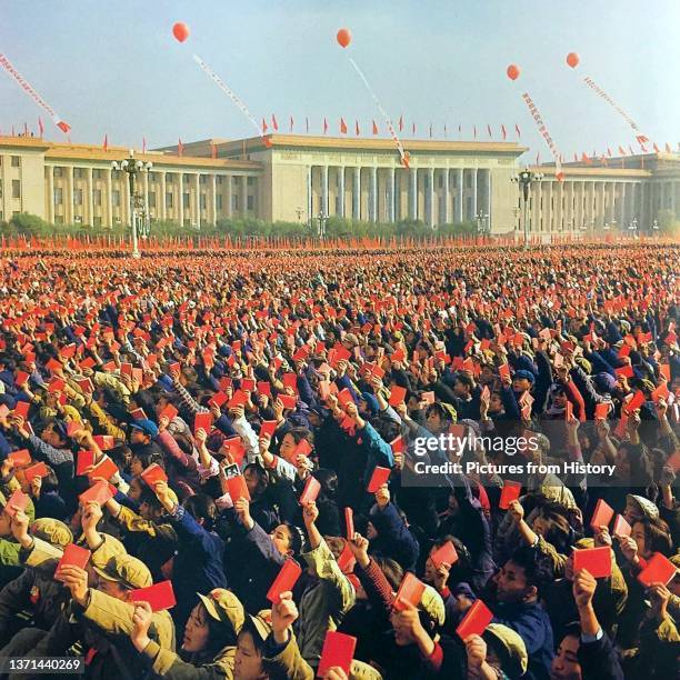 Enthusiastic 'Red Guards' wave copies of Mao Zedong's 'Little Red Book' , Tiananmen, Beijing, c. 1966.