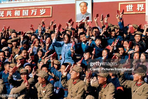 Enthusiastic 'Red Guards' wave copies of Mao Zedong's 'Little Red Book' , Tiananmen, Beijing, c. 1966.