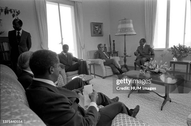 May 1 Ð President's Palace Ð Dakar, Senegal Ð Henry Kissinger, Leopold Senghor, Others Ð seated in chairs and sofas, talking Ð Secretary of State...